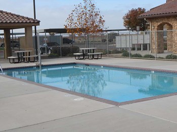 Pool with seating l Villa Esperanza Apartments in Avenal CA